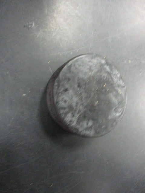 Used Black Hockey Puck