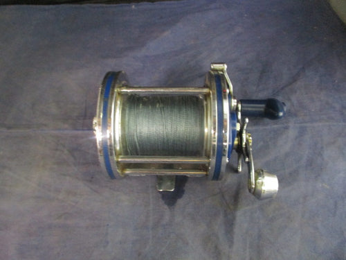 Used Olympic Dolphin 614 Fishing Reel w/ Line