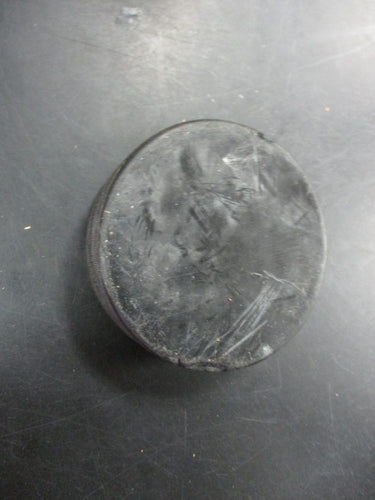 Used Black Hockey Puck