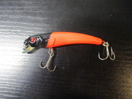 Used Black and Orange Jerk Bait Lure