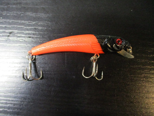 Used Black and Orange Jerk Bait Lure